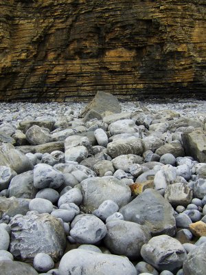 Boulders thrown against the cliffs