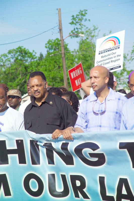 Jesse Jackson (black shirt) and New Orleans Mayor Nagin (blue checkered shirt) march into the Lower 9th Ward
