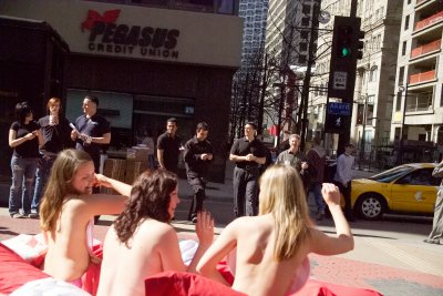 Sometimes when you go out for lunch you just find topless girls setting in the street with some banners