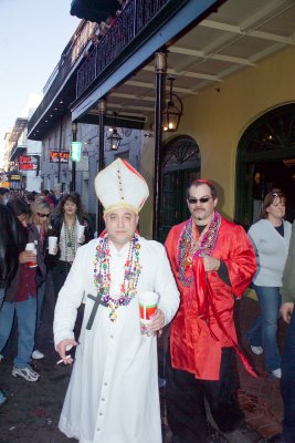 Pope and Cardinal walking on Bourbon Street taking a break.