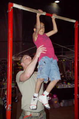 US Marine Helping this young man do pullups