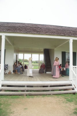 Ladies in Period Dress on Porch of the Main House