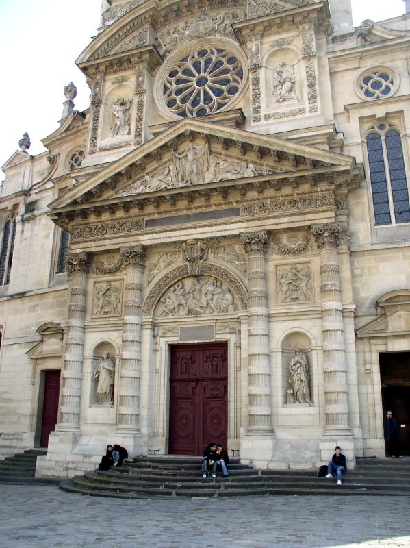 Church steps where lovers sit.