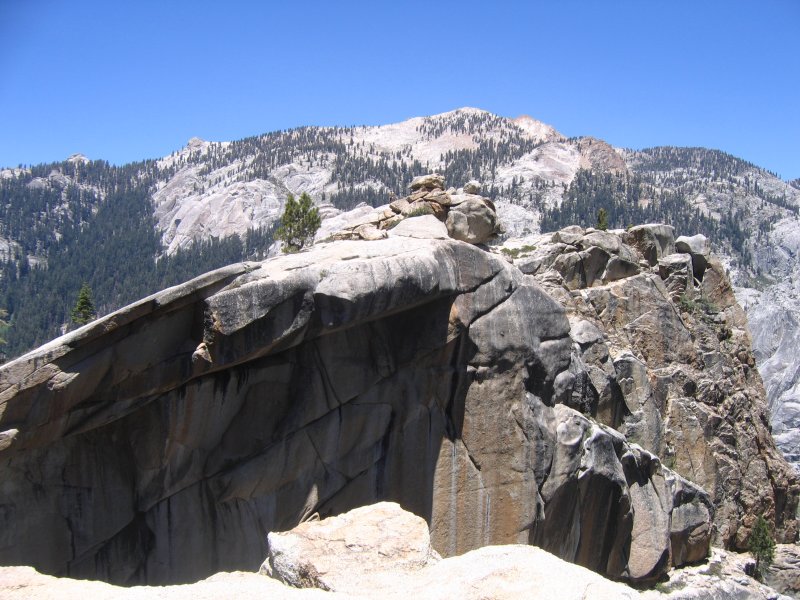 Dick heads out onto the cliff outcropping.