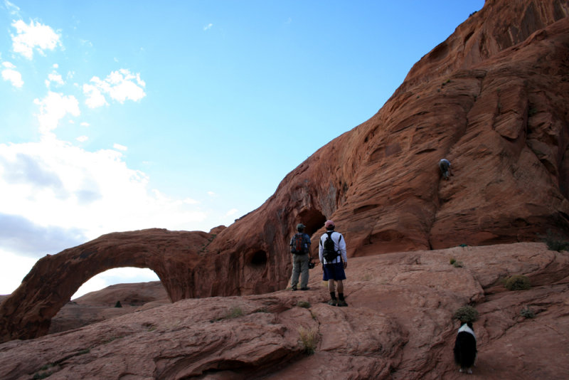 Hiker descends arch