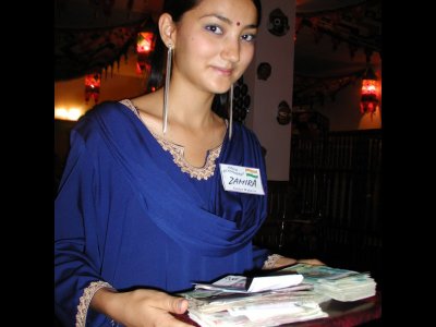 Zamira holding payment from dinner for 6, Tashkent Uzbekistan.JPG