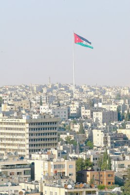Jordanian flag standing as a sentinel over the city of Amman