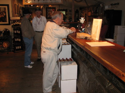 Gypsy Don Coppock bellys up to the bar at Gruene. Herb Wolfson and George Hudson in background.
