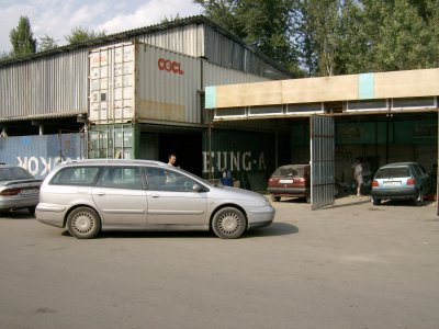 Car at little mechanic workshops after clutch went entering Almaty