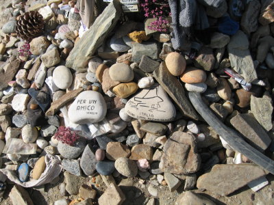 Stones left by pilgrims at the base of Cruz de Ferro