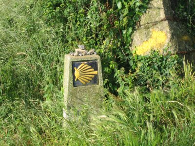 Typical Galician camino marker and yellow arrow