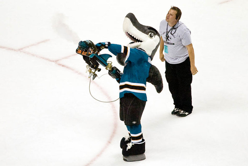 Sharkie shooting free T-shirts to the fans