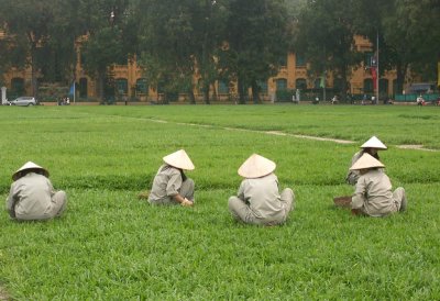 Women tending the lawn opposite Ho Chi Minh Mausoleum