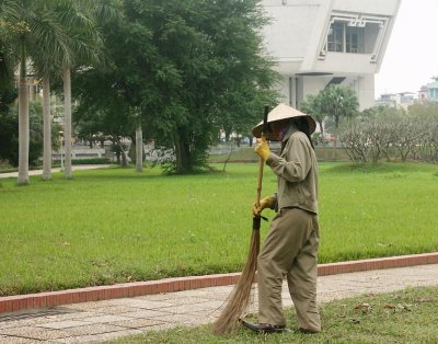 Maintenance in the park, Ho Chi Minh Museum in the background
