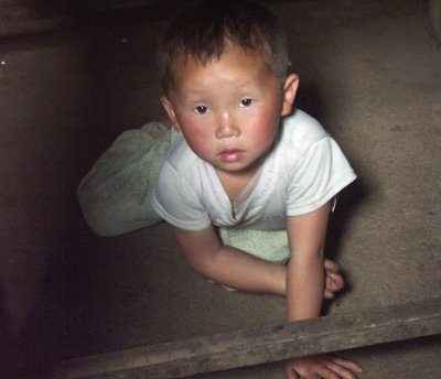 Hiding under table from tourists