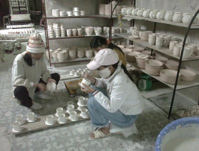 Careful workers with teacups