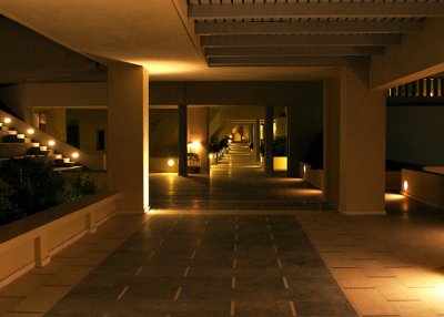 Outdoor corridor of hotel at night.jpg