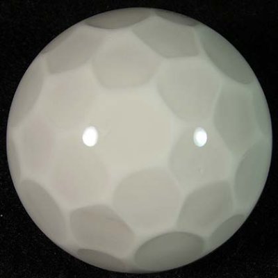 The dimpled backside looks just like a golf ball, although it is completely smooth.