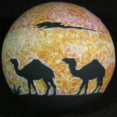 A small herd of camels is featured on this marble, happy to have found an 'oasis'.