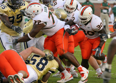 Miami TB Tyrone Moss looks for daylight