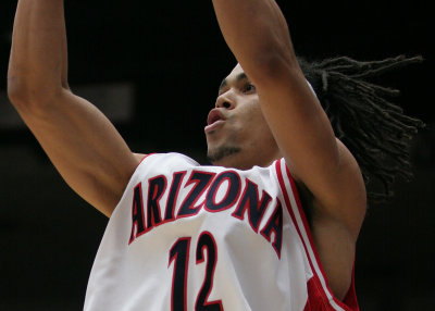 Junior guard Daniel Dillon takes a shot from the baseline