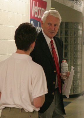 Coach Olson is interviewed in the halls of McKale Center