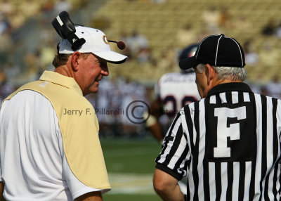 Coach Chan Gailey chats with Field Judge Jerry McGee