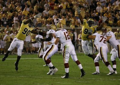 BC QB Ryan delivers a pass between GT defenders