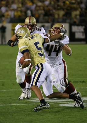 Yellow Jackets WR Greg Smith fends off BC FS Jamie Silva