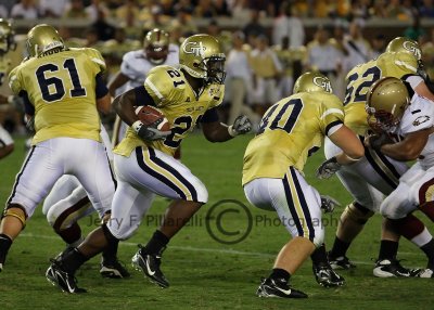 GT RB Jonathan Dwyer follows the block of FB Mike Cox