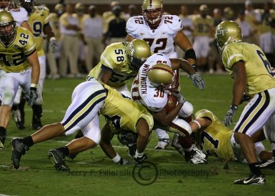 Eagles RB L . V. Whitworth is stopped by the GT defense