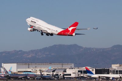 Two For One. Qantas Taking Off RWY 25R And Skywest Taking Off RWY 24L