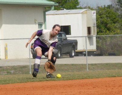 Katelyn charges a ground ball to Center
