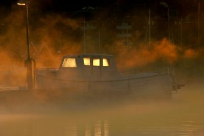 Boat in foggy morning