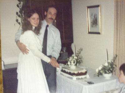 Jim and Mary, cutting the wedding cake