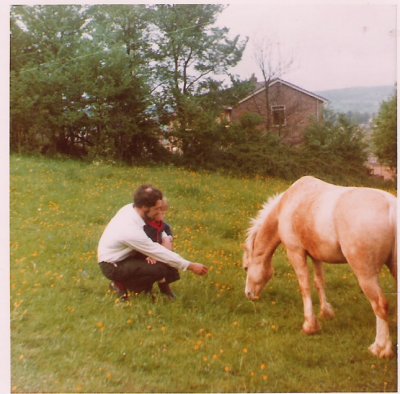Jim with Jason feeding horse