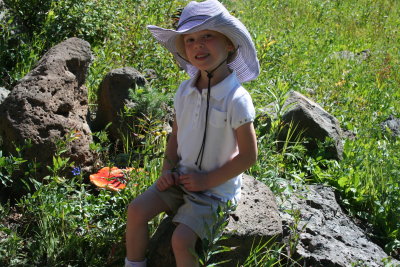 Emma on a hike with a mushroom