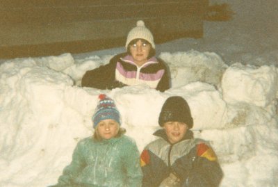 My first winter in Alaska. Our feeble attempt at an igloo. Believe it or not this was taken at about three in the afternoon. And yes it was that dark.