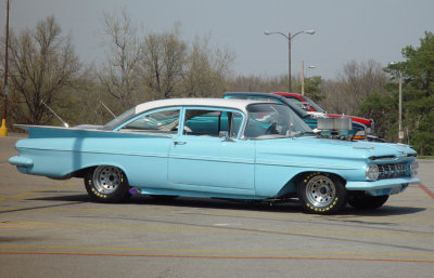 I saw this car at the shopping mall close to my house. I was sad to see that yet again, some kid had all but ruined a perfectly beautiful automobile. Then again, she's still got it.