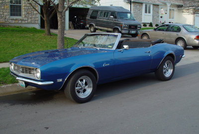 This is another gem I saw just driving down the street. I told him I'd print him some pictures if he'd just let me shoot the car. That's my gold Maxima sitting in the driveway.