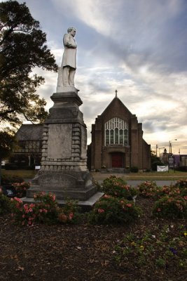 Old Catholic Chruch with statue of Sam Noble, founder of Anniston