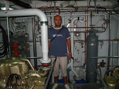 Massimo inside the machine room of a Guardia di Finanza boat