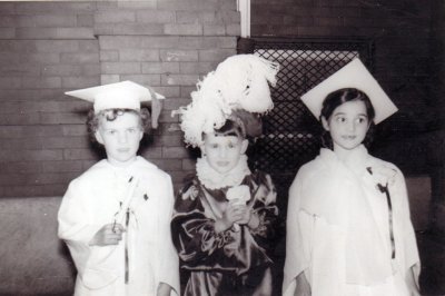 My mom (right) at her kindergarten graduation with her brother Tommy (middle)