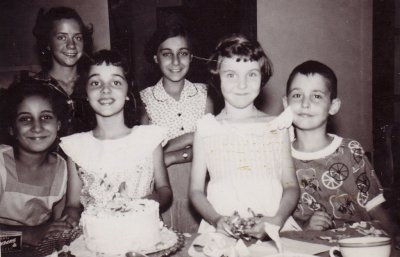 Joyce (with birthday cake), Babette, Tommy, and friends