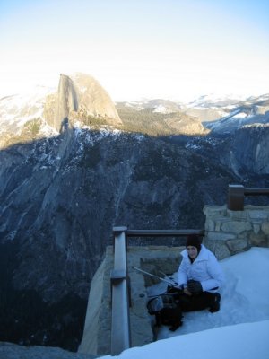 Della sets up her photo gear next to a 3,000 foot drop to Yosemite Valley (gulp)