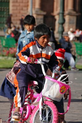 Cuzco boy on his sister's bike