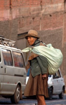 Local Cuzco woman with typical back-bag
