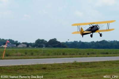 Joe Pendergrass Boeing A-75 Stearman N1715B picking up ad banner private aviation stock photo #6311