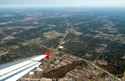 North of downtown Minneapolis with Crystal Airport just above the right wing tip aerial stock photo #2112