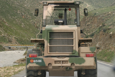 Following a military bulldozer